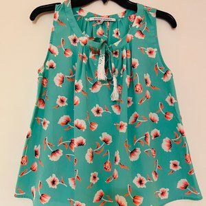 Collective concepts mint green with bright orange and white flower design